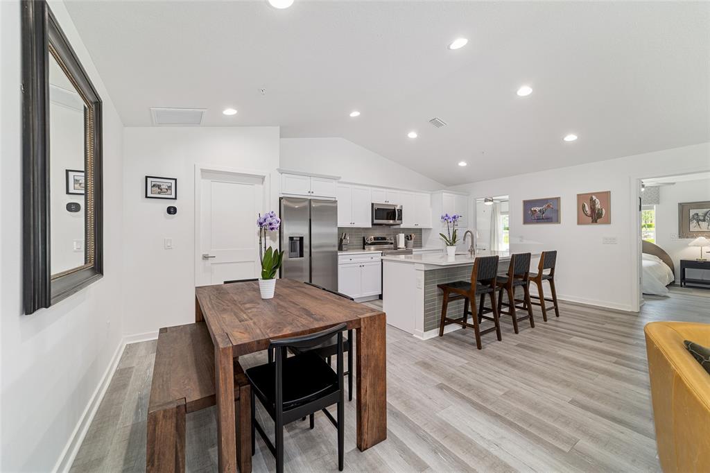 4400 Northwest 74th Terrace Ocala, FL 34482 - Photo 11 of 39 a view of a dining room with furniture and wooden floor