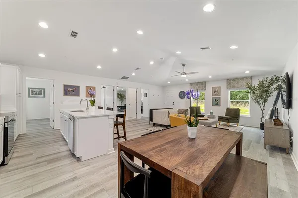 an open kitchen with a table and chairs in it