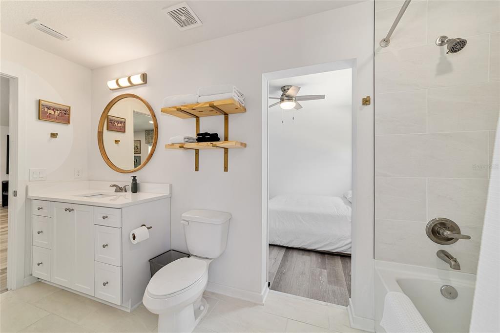 4400 Northwest 74th Terrace Ocala, FL 34482 - Photo 30 of 39 a bathroom with a toilet a sink and a shower