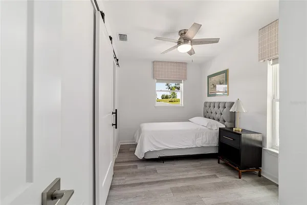 a bedroom with a bed and a closet