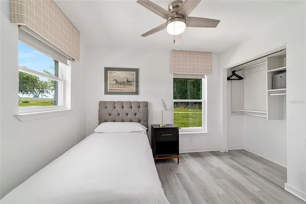 a bedroom with a bed and a window