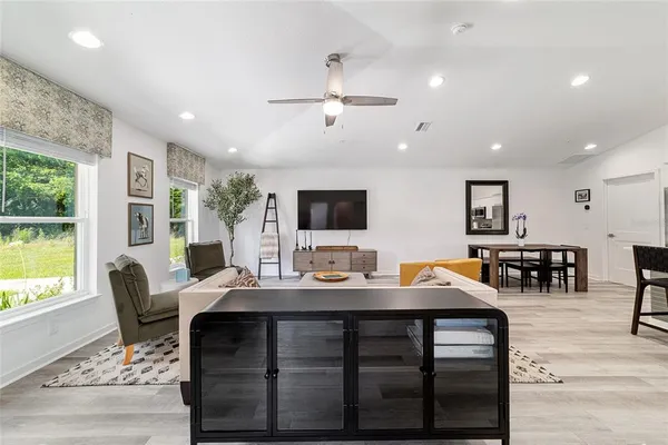 a view of a dining room with furniture window and outside view