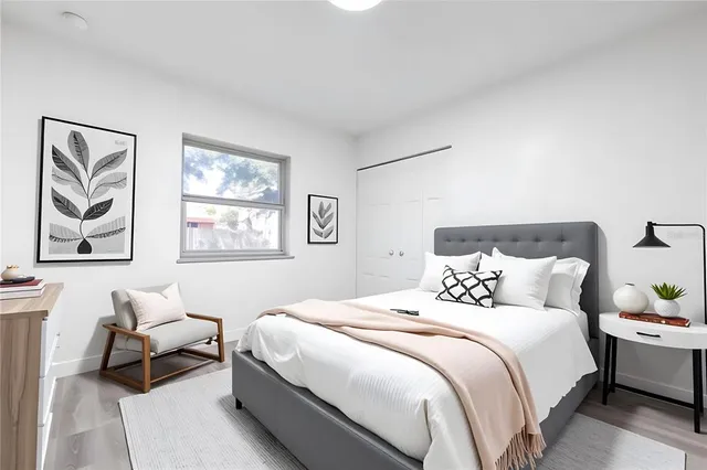 a bedroom with a bed and a couch