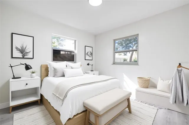 a bedroom with a bed and a couch