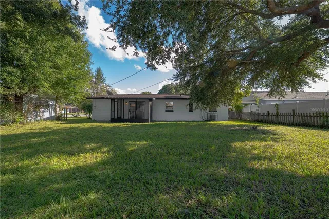 a view of a house with a back yard