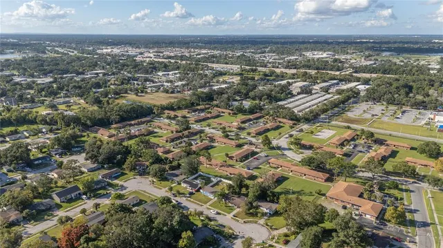 an aerial view of residential building with parking space