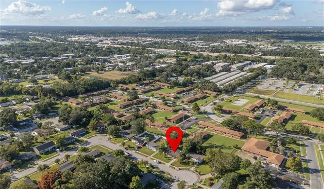 an aerial view of residential houses with outdoor space