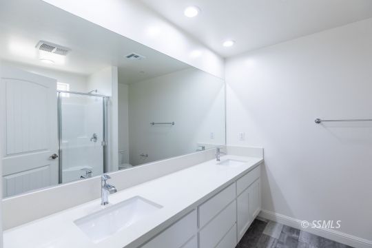 1012 Sims Street Ridgecrest, CA 93555 - Photo 29 of 36 a bathroom with a sink double vanity and a mirror