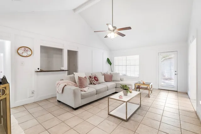 a living room with furniture and a window