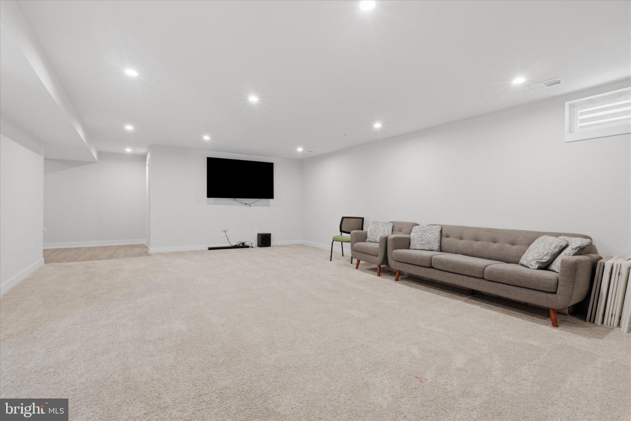21839 Clarksburg Road Clarksburg, MD 20841 - Photo 27 of 39 Spacious, modern basement retreat.
