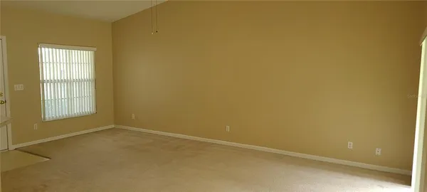 an empty room with a empty space and a window