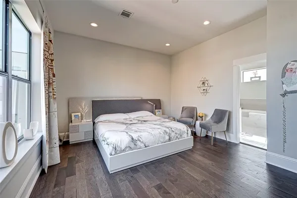 a bathroom with a bathtub and shower