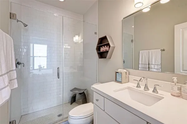 a terrace with outdoor seating and city view