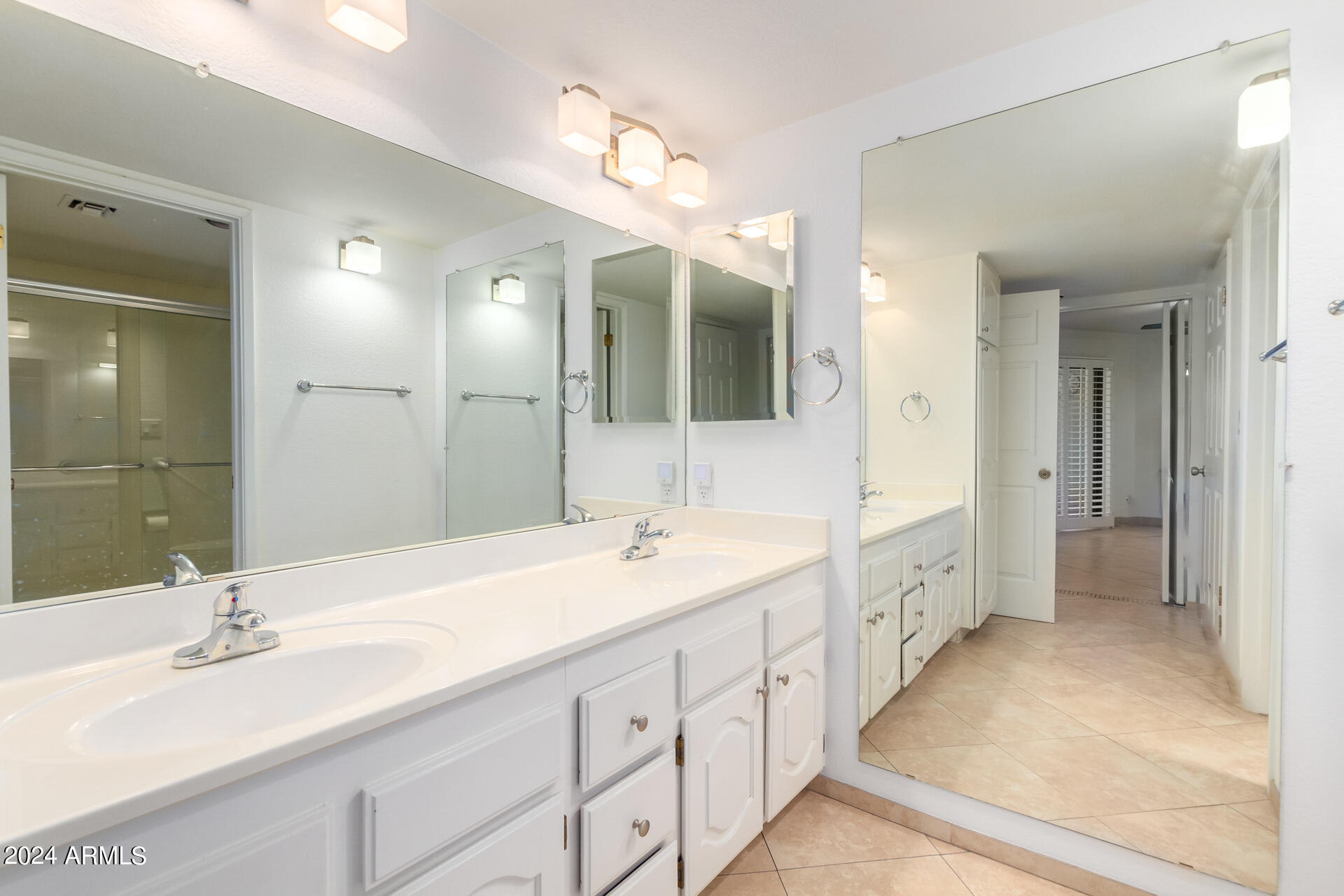 4303 East Cactus Road, Unit 442 Phoenix, AZ 85032 - Photo 10 of 27 Bathroom with double vanity sinks