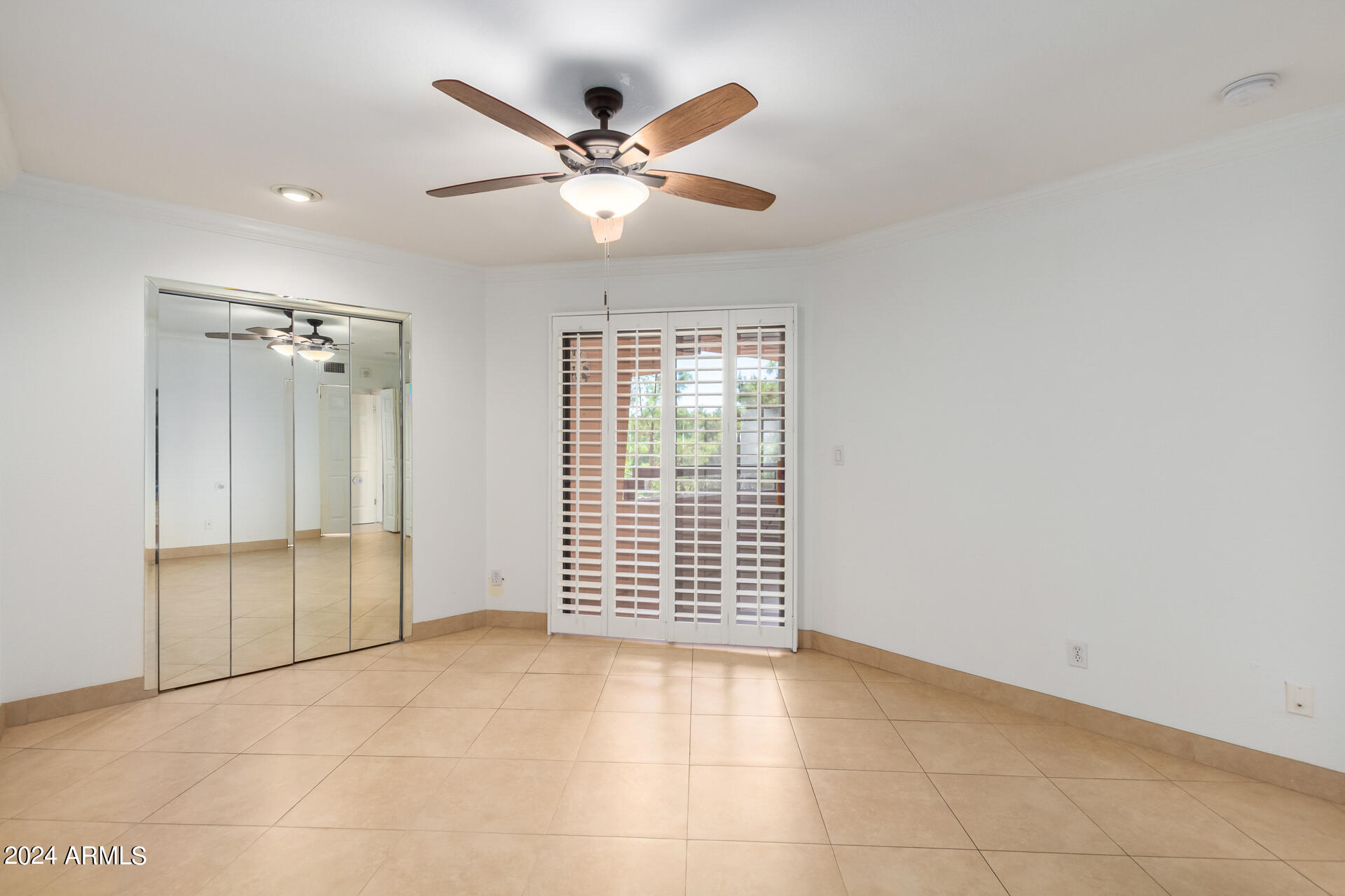 4303 East Cactus Road, Unit 442 Phoenix, AZ 85032 - Photo 9 of 27 Spacious bedroom with balcony access