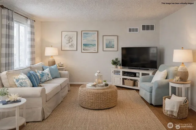 a kitchen with stainless steel appliances granite countertop a refrigerator and a stove