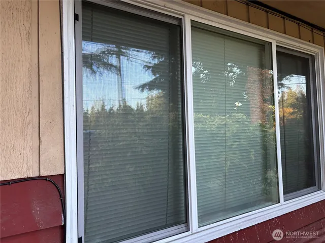 a view of a bathroom that has a glass door