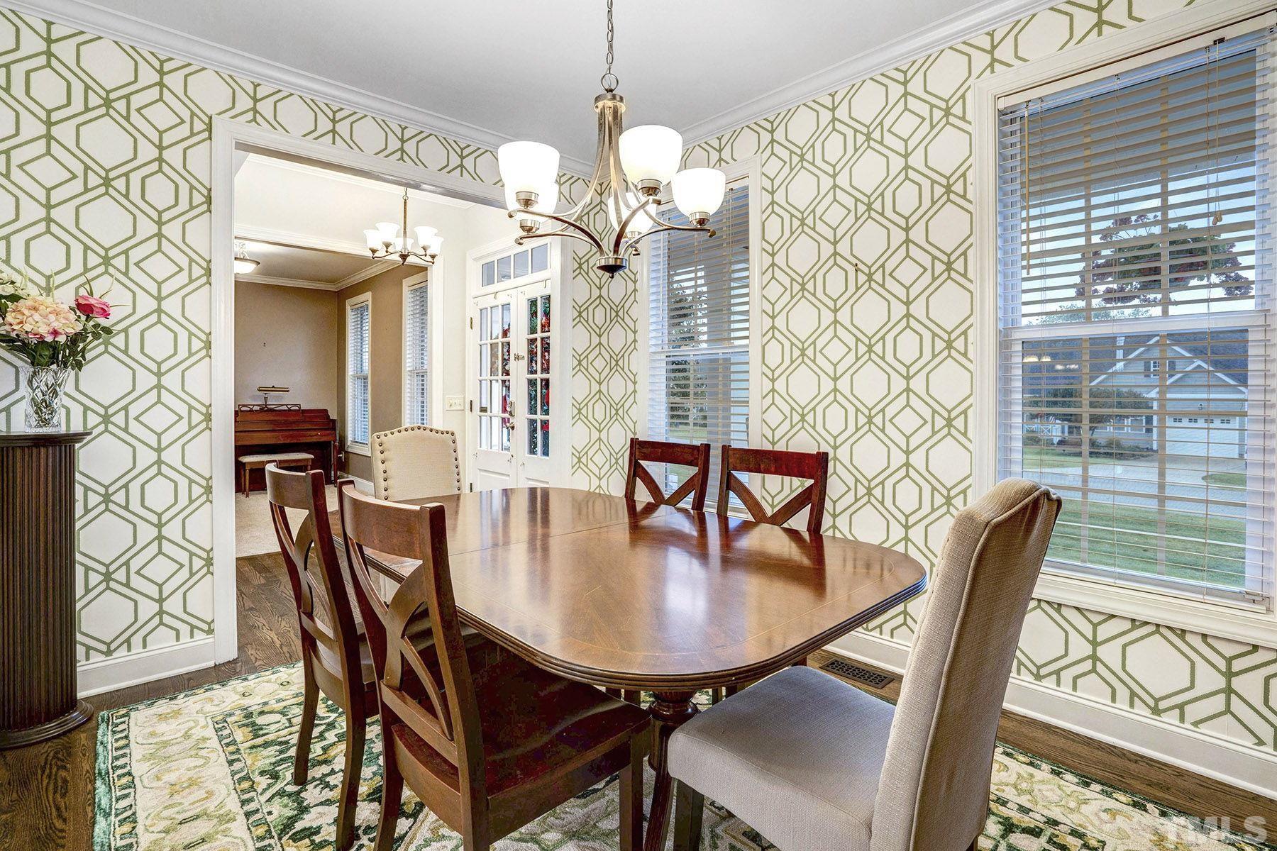 4933 Contender Drive Raleigh, NC 27603 - Photo 12 of 37 a dining room with furniture and window