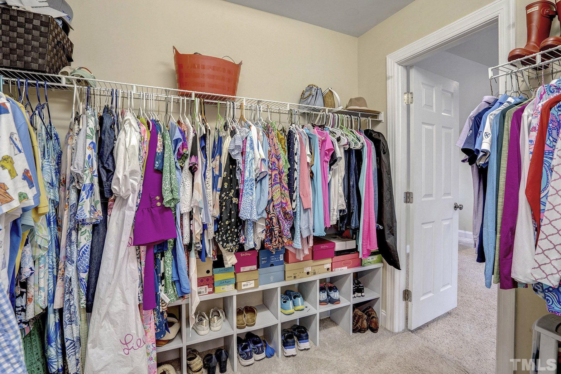 4933 Contender Drive Raleigh, NC 27603 - Photo 26 of 37 a view of walk in closet with clothes