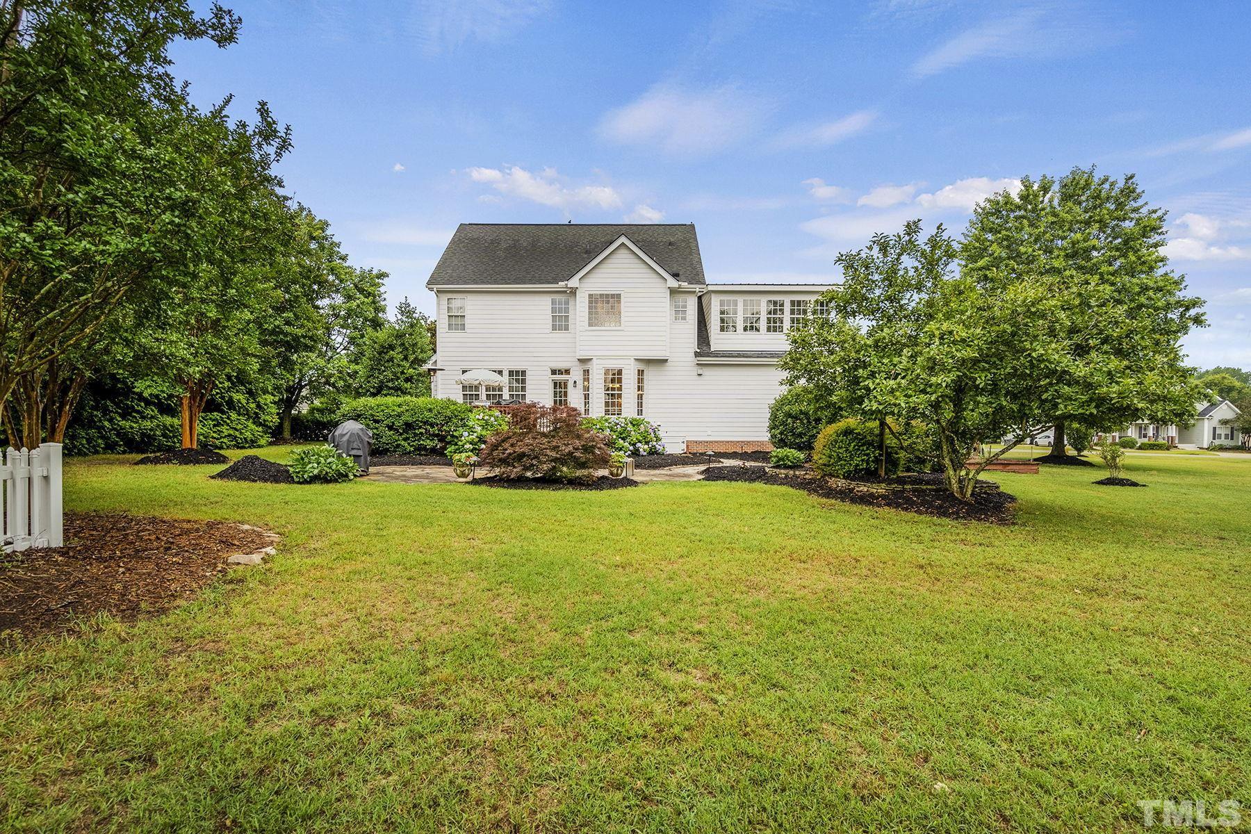 4933 Contender Drive Raleigh, NC 27603 - Photo 36 of 37 a front view of a house with garden