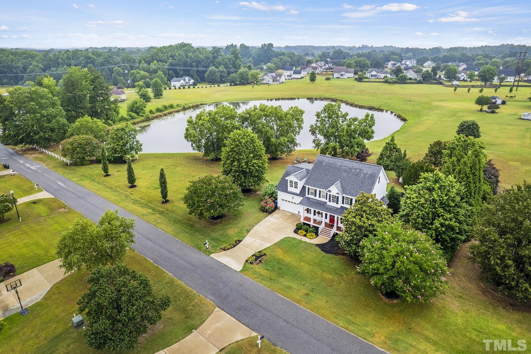 4933 Contender Drive Raleigh, NC 27603 - Photo 4 of 37 an aerial view of ocean and residential houses with outdoor space