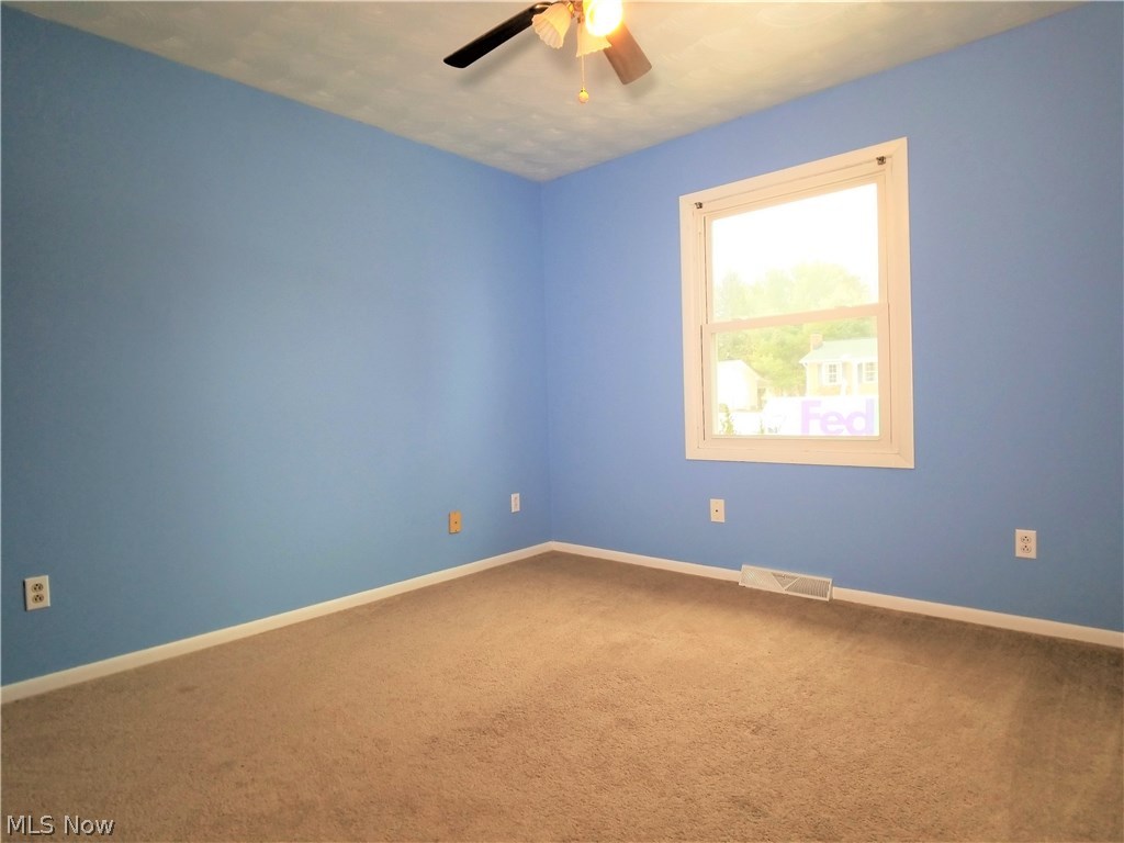 1560 Reed Street Canal Fulton, OH 44614 - Photo 5 of 7 3rd spacious bedroom is light and airy with great closet space.