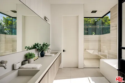 a bathroom with a tub and shower