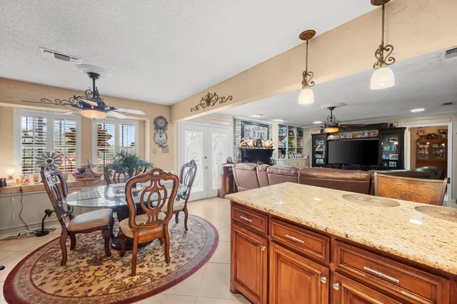a large kitchen with a table and chairs