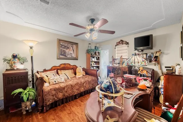 a bed room with a bed and a television