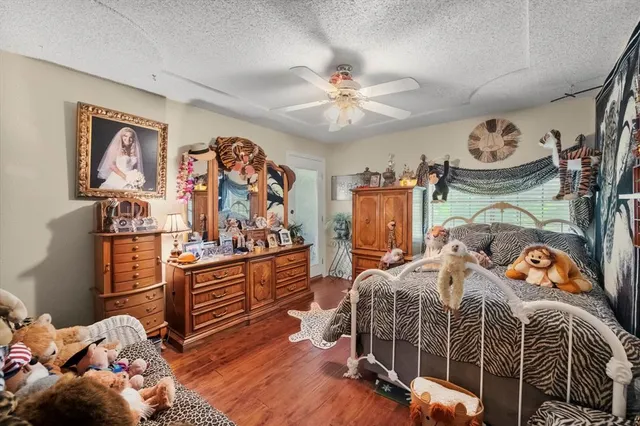 a bedroom with furniture and a chandelier