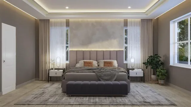 a living room with furniture and a potted plant