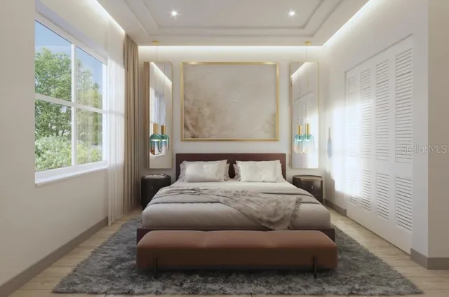 a bedroom with furniture and windows