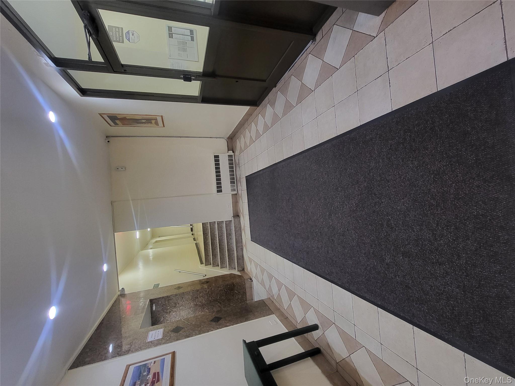 Undisclosed Address Queens, NY 11423 - Photo 22 of 22 Community lobby with recessed lighting and stairs