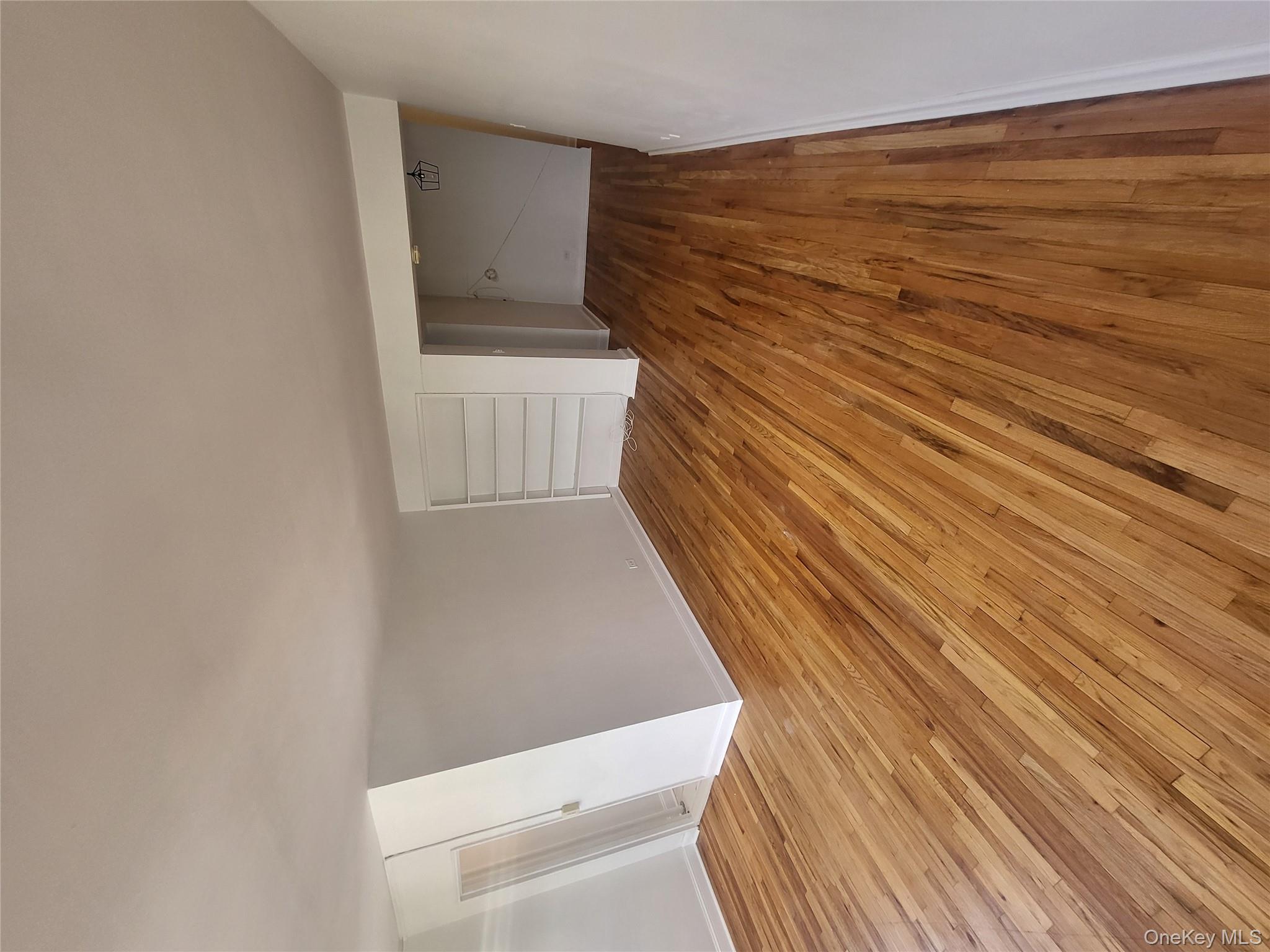 Undisclosed Address Queens, NY 11423 - Photo 9 of 22 Unfurnished bedroom featuring light wood-type flooring