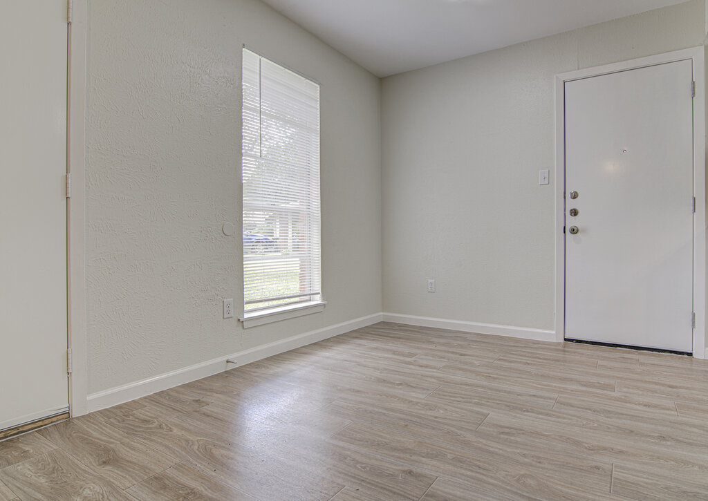 5301 Indio Circle, Unit A Austin, TX 78745 - Photo 7 of 25 The wood-look flooring sets a welcoming tone in this naturally illuminated entry.