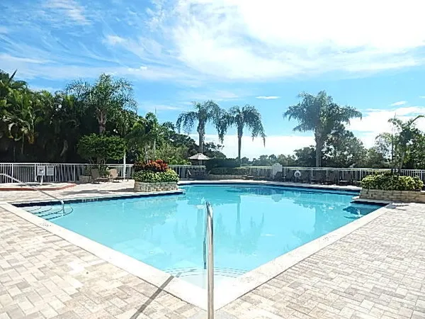 a view of a swimming pool with lounge chair