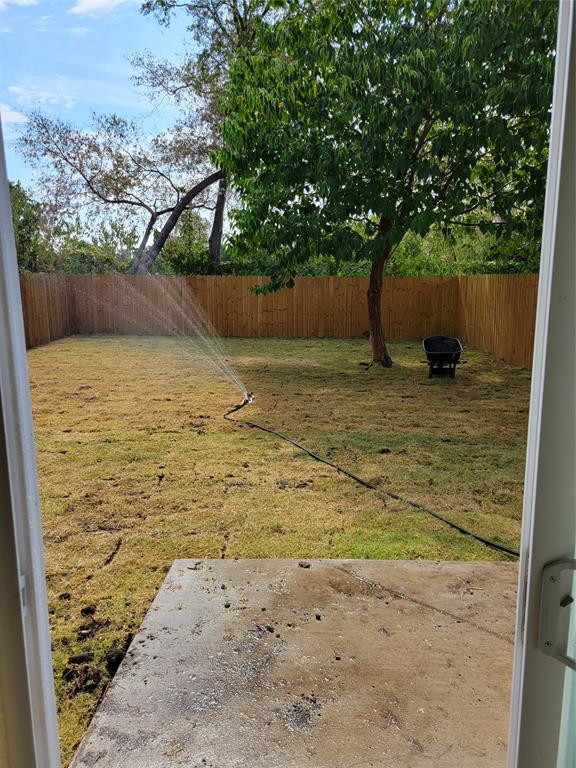 4714 Frank Street Dallas, TX 75210 - Photo 22 of 22 a view of a yard with a tree