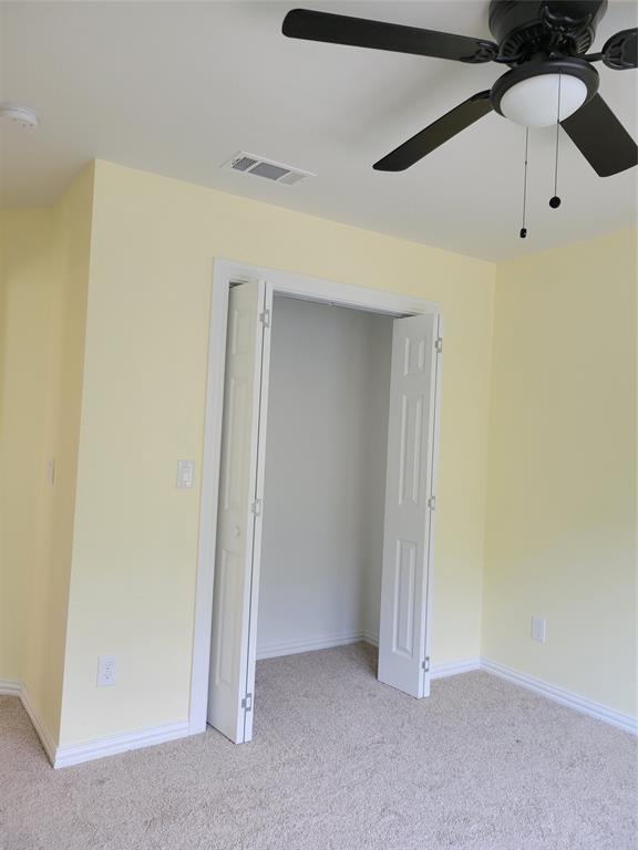 4714 Frank Street Dallas, TX 75210 - Photo 9 of 22 an empty room with yellow walls