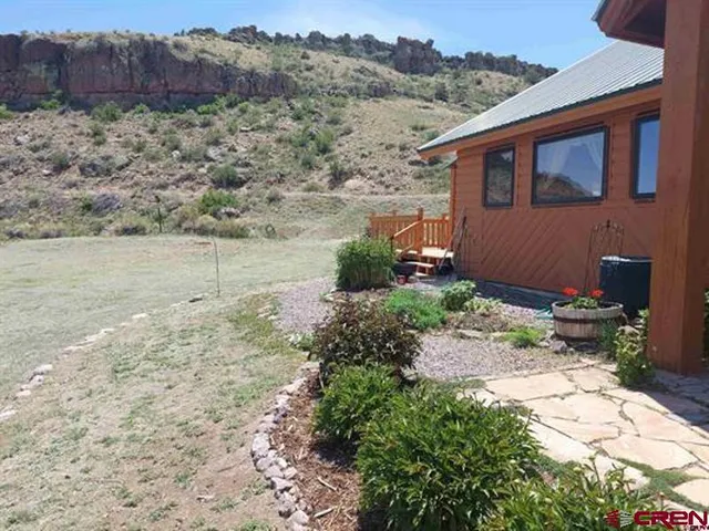a backyard of a house with lots of green space