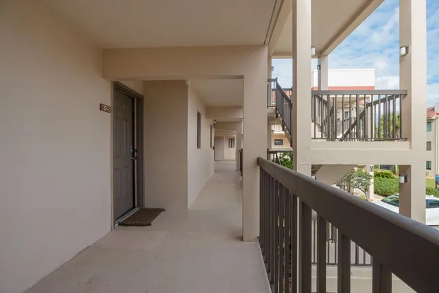 a view of hallway with windows