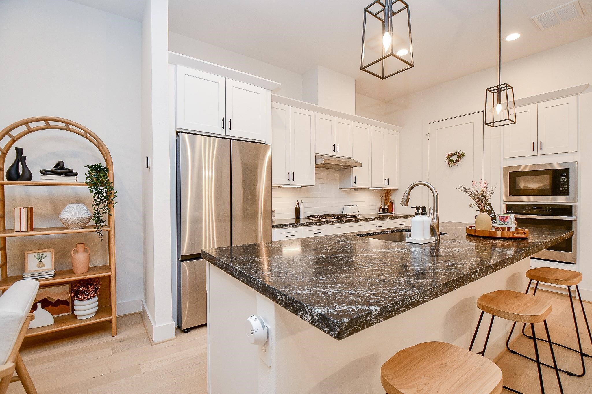 4403 Greeley Street Houston, TX 77006 - Photo 7 of 28 a kitchen with stainless steel appliances granite countertop a sink a stove and refrigerator