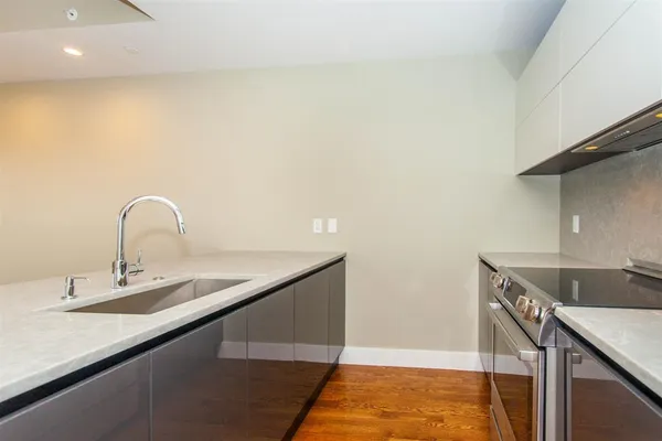 a kitchen with a sink and cabinets