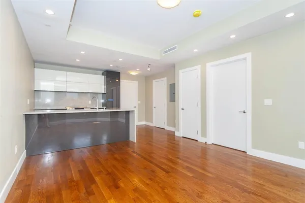 a view of kitchen with wooden floor