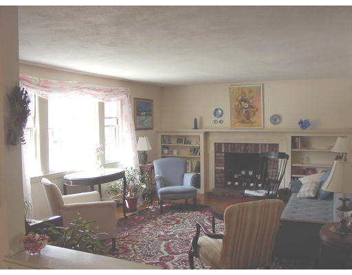 25 Maple Ridge Road Reading, MA 01867 - Photo 3 of 5 a living room with furniture and a fireplace