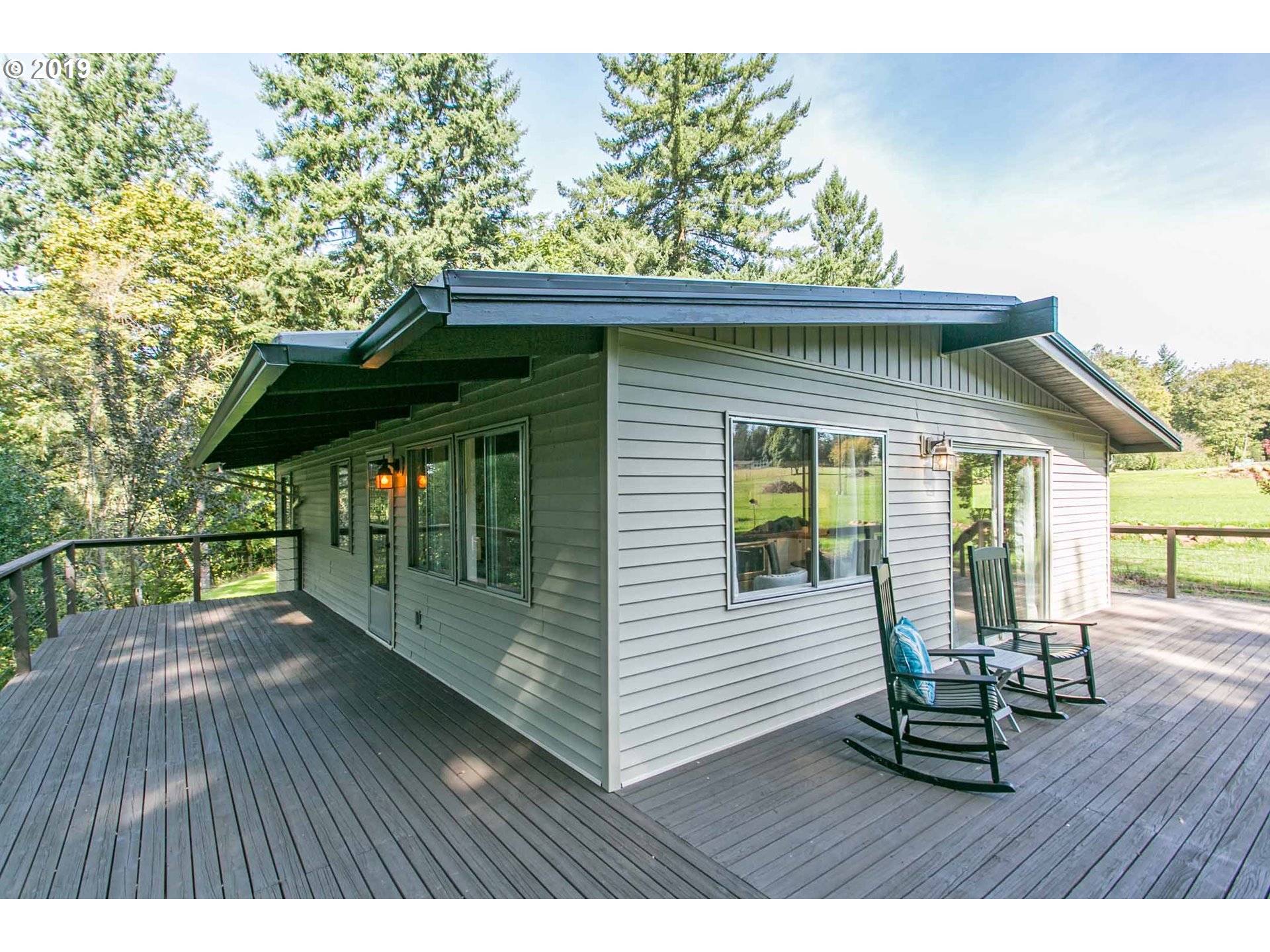 13010 South Union Hall Road Canby, OR 97013 - Photo 2 of 31 a view of a chairs with a wooden deck
