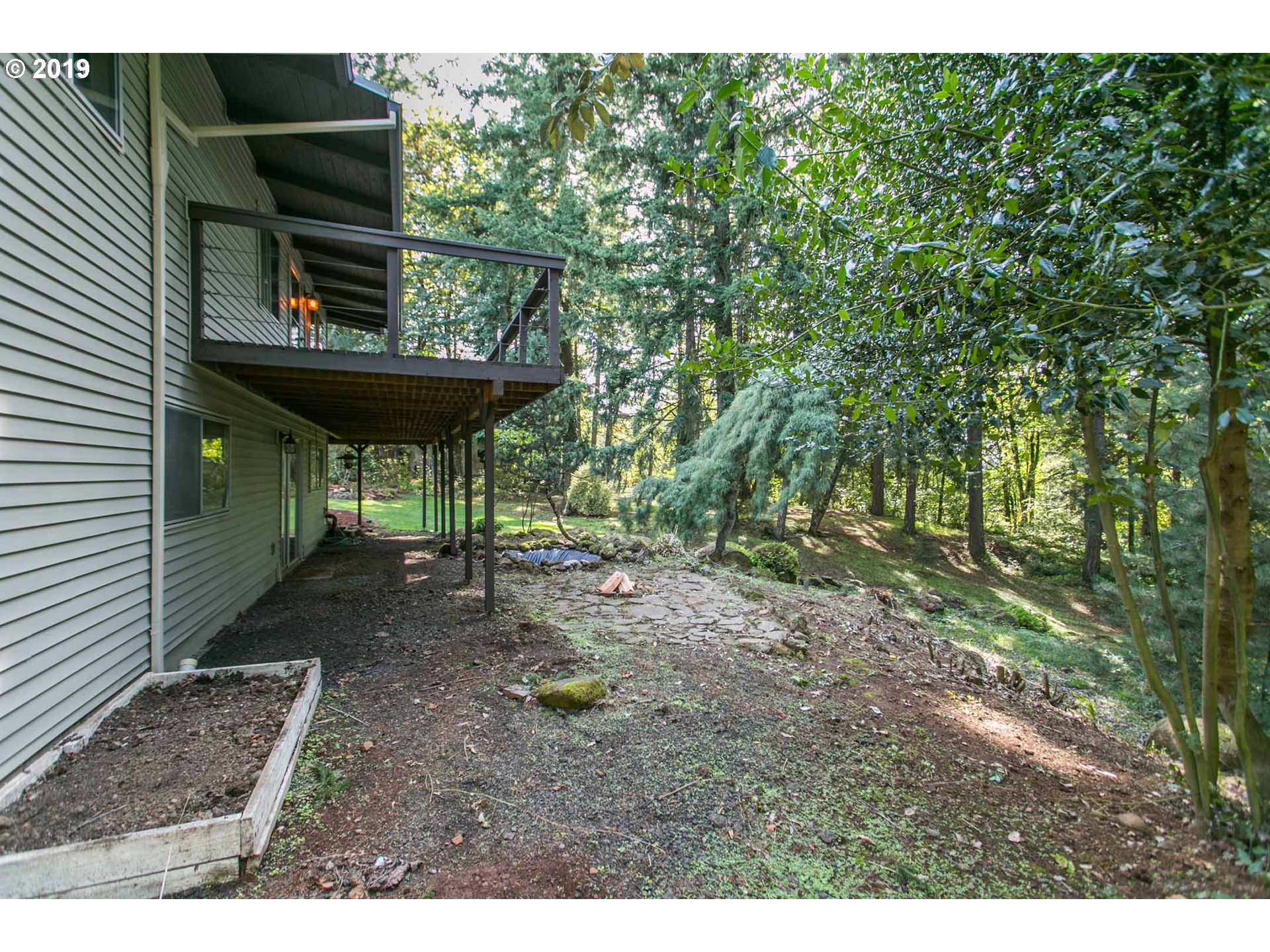 13010 South Union Hall Road Canby, OR 97013 - Photo 24 of 31 a backyard of a house with table and chairs