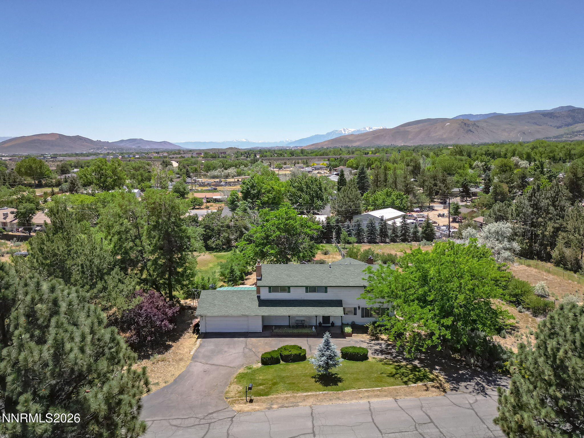 549 Ruby Lane Carson City, NV 89706 - Photo 3 of 37 a view of a city with lush green forest