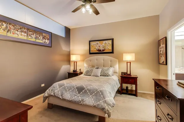 a bedroom with a bed and a dresser