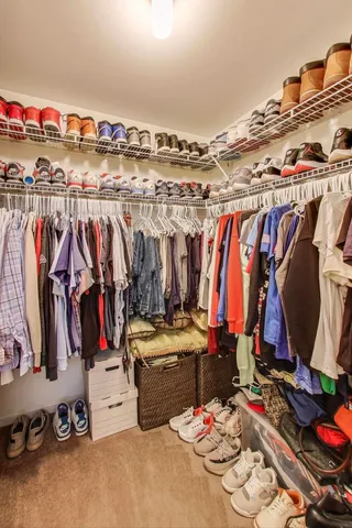 a view of a livingroom with workspace and a window