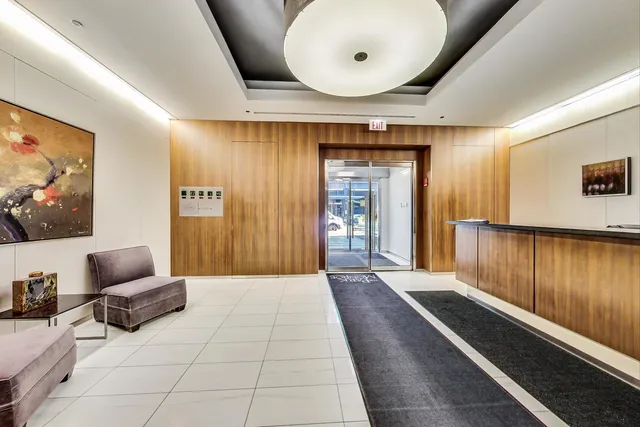 a lobby with furniture and window